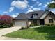 Charming brick home featuring a well-manicured lawn and a two-car garage at 621 Thorne Dr, Brownsburg, IN 46112
