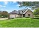 Well-maintained brick home with lush front yard and landscaping at 621 Thorne Dr, Brownsburg, IN 46112