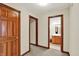 Hallway showcasing a bathroom with a classic vanity and tiled floors at 621 Thorne Dr, Brownsburg, IN 46112