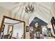 Hallway view into a living room with fireplace and high ceilings and dining room at 621 Thorne Dr, Brownsburg, IN 46112