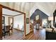 Hallway view into a living room with fireplace and high ceilings at 621 Thorne Dr, Brownsburg, IN 46112