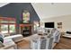 Spacious living room features a fireplace, vaulted ceiling, and large windows providing ample natural light at 621 Thorne Dr, Brownsburg, IN 46112