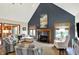 Bright living room features a fireplace, vaulted ceiling, and neutral colored furniture at 621 Thorne Dr, Brownsburg, IN 46112