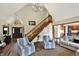 Inviting living room features a staircase, neutral color palette, and an open layout at 621 Thorne Dr, Brownsburg, IN 46112