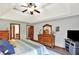 Spacious bedroom with a coffered ceiling, ceiling fan, and wood dresser at 621 Thorne Dr, Brownsburg, IN 46112
