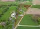 Aerial view showcasing the property lines of a ranch-style home on a large lot surrounded by greenery at 6212 Rocklane Rd, Greenwood, IN 46143