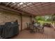 Backyard deck with a grill, comfortable seating, and outdoor dining area, perfect for outdoor gatherings and relaxation at 6212 Rocklane Rd, Greenwood, IN 46143
