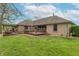 Expansive backyard featuring a spacious deck with pergola, perfect for outdoor relaxation and entertaining at 6212 Rocklane Rd, Greenwood, IN 46143