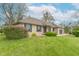 Beautiful brick ranch-style home with a well-maintained lawn and an American flag in the front yard at 6212 Rocklane Rd, Greenwood, IN 46143