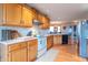 Bright kitchen with white countertop, stainless steel appliances, and wood cabinetry at 6212 Rocklane Rd, Greenwood, IN 46143