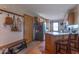 Kitchen featuring a breakfast bar with wood cabinets and stainless steel appliances at 6212 Rocklane Rd, Greenwood, IN 46143