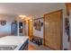 Mudroom with coat rack, wooden bench, and decorative accents, seamlessly connecting to the rest of the house at 6212 Rocklane Rd, Greenwood, IN 46143