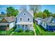 Attractive two-story home with a cozy front porch and well-defined landscaping at 625 Arbor Ave, Indianapolis, IN 46221