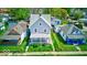 A well-kept two-story house with a fenced yard and classic architectural details at 625 Arbor Ave, Indianapolis, IN 46221
