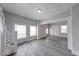 Open-concept living area with large windows and easy access to entry and stairs at 625 Arbor Ave, Indianapolis, IN 46221