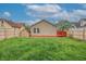 Large backyard featuring new wood fence, a small storage shed, and ample space for outdoor enjoyment at 625 Maple St, Columbus, IN 47201
