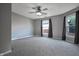 Spacious bedroom featuring a ceiling fan, and plush neutral carpeting throughout at 625 Maple St, Columbus, IN 47201