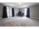Neutral color bedroom with plush carpet, bright windows, and ample natural light at 625 Maple St, Columbus, IN 47201