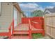 Outdoor deck and backyard, perfect for relaxing or entertaining guests, featuring a red painted surface at 625 Maple St, Columbus, IN 47201