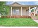 Charming single-Gathering home featuring a spacious front porch and inviting curb appeal at 625 Maple St, Columbus, IN 47201