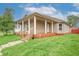 Inviting home with a welcoming front porch, a perfect spot to relax and enjoy the outdoors at 625 Maple St, Columbus, IN 47201