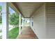 A view down the covered front porch, great for relaxing or enjoying the outdoors at 625 Maple St, Columbus, IN 47201
