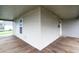 Corner view of the large, covered front porch showing the perfect space to enjoy the outdoors at 625 Maple St, Columbus, IN 47201
