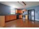 Kitchen area featuring wooden cabinets and black appliances at 625 Maple St, Columbus, IN 47201