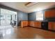 Functional kitchen featuring wood cabinets and a large adjacent dining area at 625 Maple St, Columbus, IN 47201