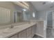 Bright bathroom featuring a double sink vanity, a large mirror with vanity lighting, and updated finishes at 6337 Whitaker Farms Dr, Indianapolis, IN 46237