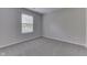 Bright bedroom with large window and plush carpeting, creating a comfortable retreat at 6337 Whitaker Farms Dr, Indianapolis, IN 46237