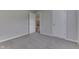 Bedroom view showcasing gray walls, carpet and open doorway at 6337 Whitaker Farms Dr, Indianapolis, IN 46237