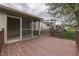A view of a home's deck, complete with a screened-in porch and charming wooden swing at 6337 Whitaker Farms Dr, Indianapolis, IN 46237