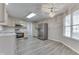 Bright kitchen features stainless steel appliances, neutral cabinets, and wood flooring at 6337 Whitaker Farms Dr, Indianapolis, IN 46237