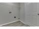 Functional laundry room boasts overhead shelving, utility connections, and a clean, well-maintained space at 6337 Whitaker Farms Dr, Indianapolis, IN 46237