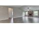 Cozy living room with fireplace, gray walls, and gray wood floors at 6337 Whitaker Farms Dr, Indianapolis, IN 46237