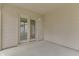 A view of a covered back patio that has double doors leading inside the residence at 6337 Whitaker Farms Dr, Indianapolis, IN 46237