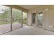 Screened-in porch leading to a wood deck offering seamless indoor-outdoor living and backyard views at 6337 Whitaker Farms Dr, Indianapolis, IN 46237