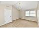 Spacious bedroom featuring plush carpet, neutral paint, a ceiling fan, and natural light at 6352 Watercrest Way, Indianapolis, IN 46278