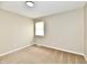 Inviting bedroom featuring neutral walls, plush carpeting, and a bright, sunny window at 6352 Watercrest Way, Indianapolis, IN 46278