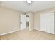 Bedroom featuring carpet, neutral walls, a walk-in closet, and a hallway in the background at 6352 Watercrest Way, Indianapolis, IN 46278