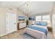 Comfortable bedroom featuring a vaulted ceiling, a decorative chandelier, and soft, neutral tones at 6352 Watercrest Way, Indianapolis, IN 46278