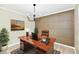 Staged home office ready for working from home, with a modern light fixture above at 6352 Watercrest Way, Indianapolis, IN 46278