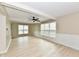 Bright, open living room with a ceiling fan and lots of natural light at 6352 Watercrest Way, Indianapolis, IN 46278
