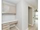 Dedicated office nook featuring stylish cabinetry, quartz countertop, and mosaic tile backsplash at 6352 Watercrest Way, Indianapolis, IN 46278