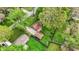 Aerial perspective of a well-maintained residential property with lush greenery, a garage, and a spacious backyard at 6837 Doris Dr, Indianapolis, IN 46214