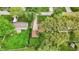 An aerial view of a well-kept lawn with mature trees surrounding a home at 6837 Doris Dr, Indianapolis, IN 46214