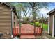 Backyard with a deck, play area, and detached garage perfect for outdoor enjoyment at 6837 Doris Dr, Indianapolis, IN 46214