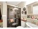 Bathroom featuring glass enclosed shower, vanity, sink, and decorative wall mirrors at 6837 Doris Dr, Indianapolis, IN 46214