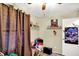 Nicely decorated bedroom with warm accents, shelving, and fun character themed decor at 6837 Doris Dr, Indianapolis, IN 46214